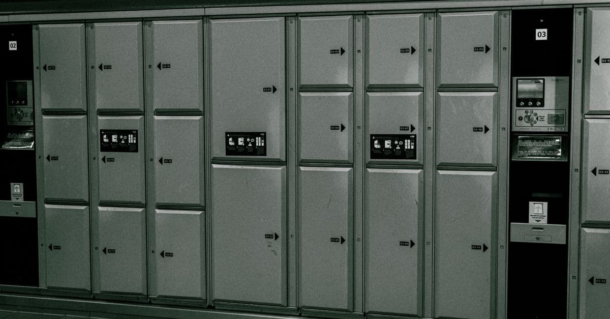 Secure metal lockers with electronic payment system at a station.