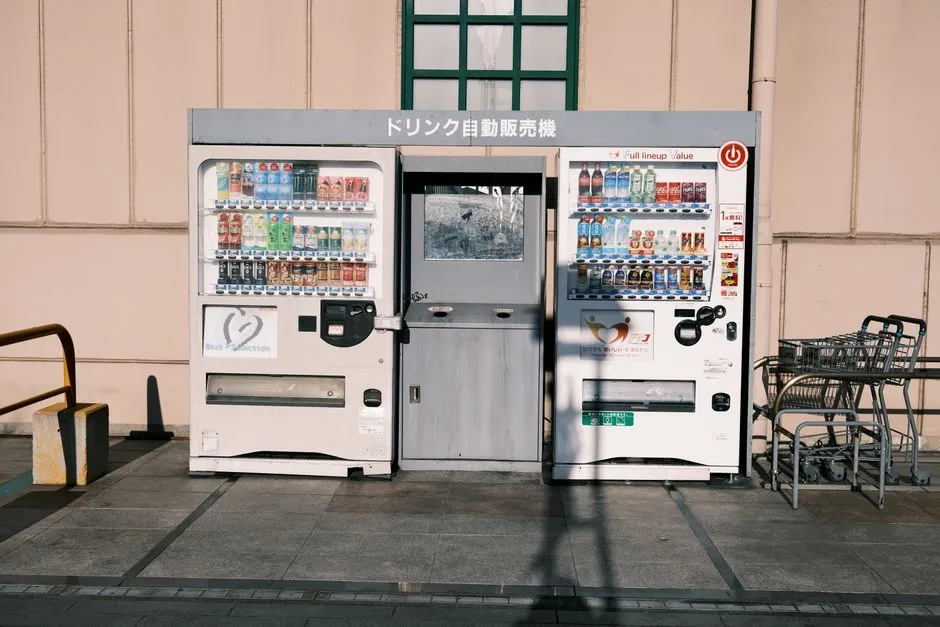 Vending machines in Gamagōri, Japan offer diverse drinks in a city setting.