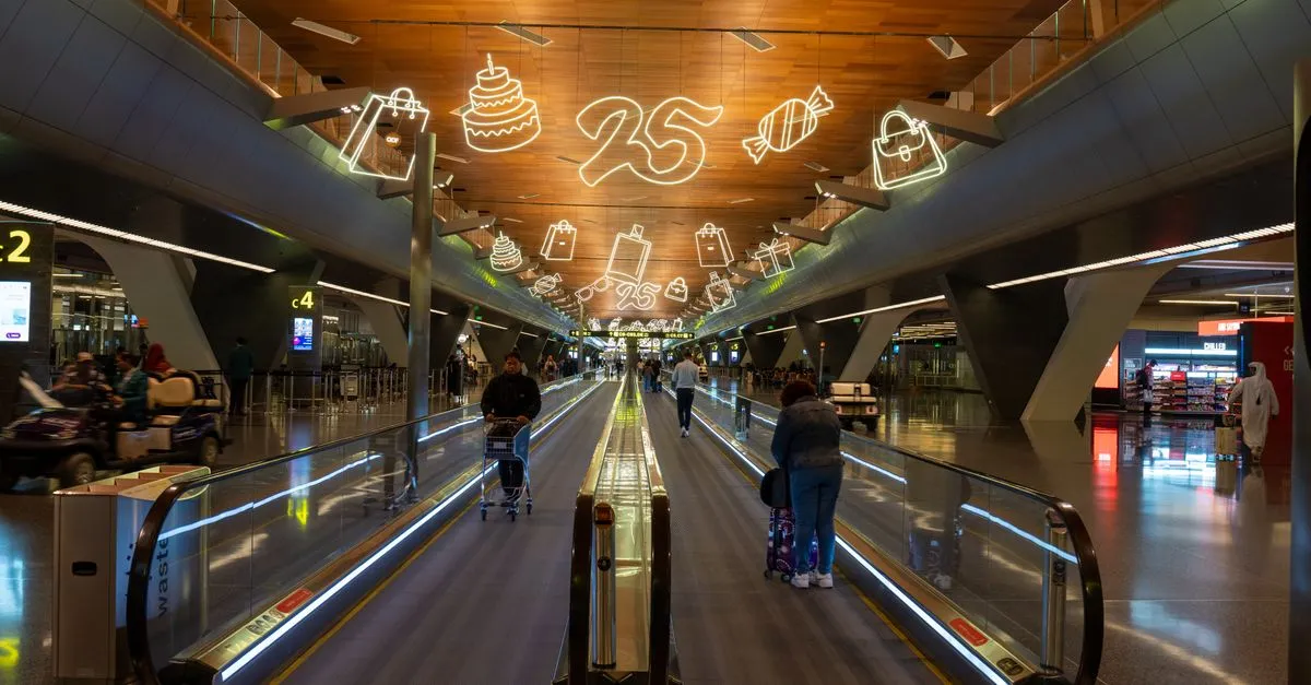 Passenger using self-service check-in kiosk at airport for convenient travel experience.